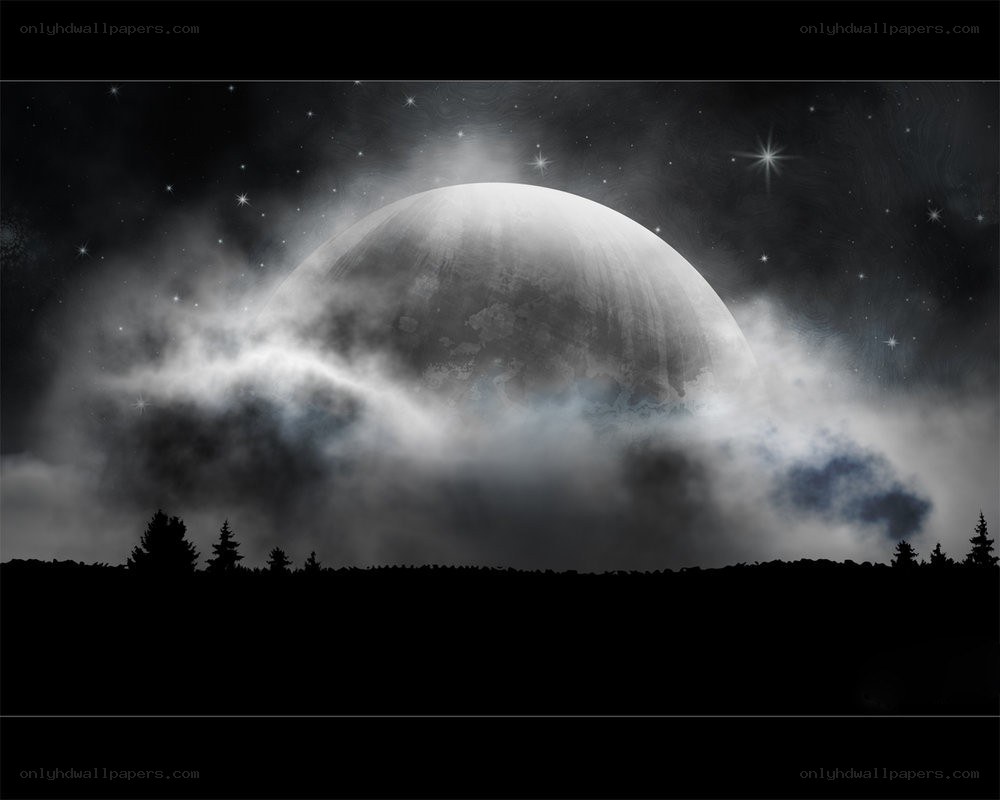 Moon behind clouds at night