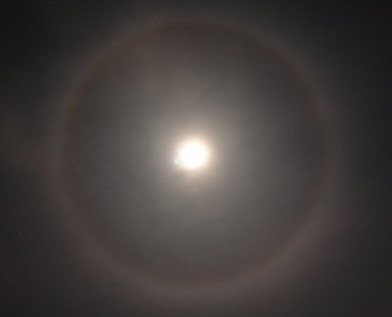 Moon halo in night sky