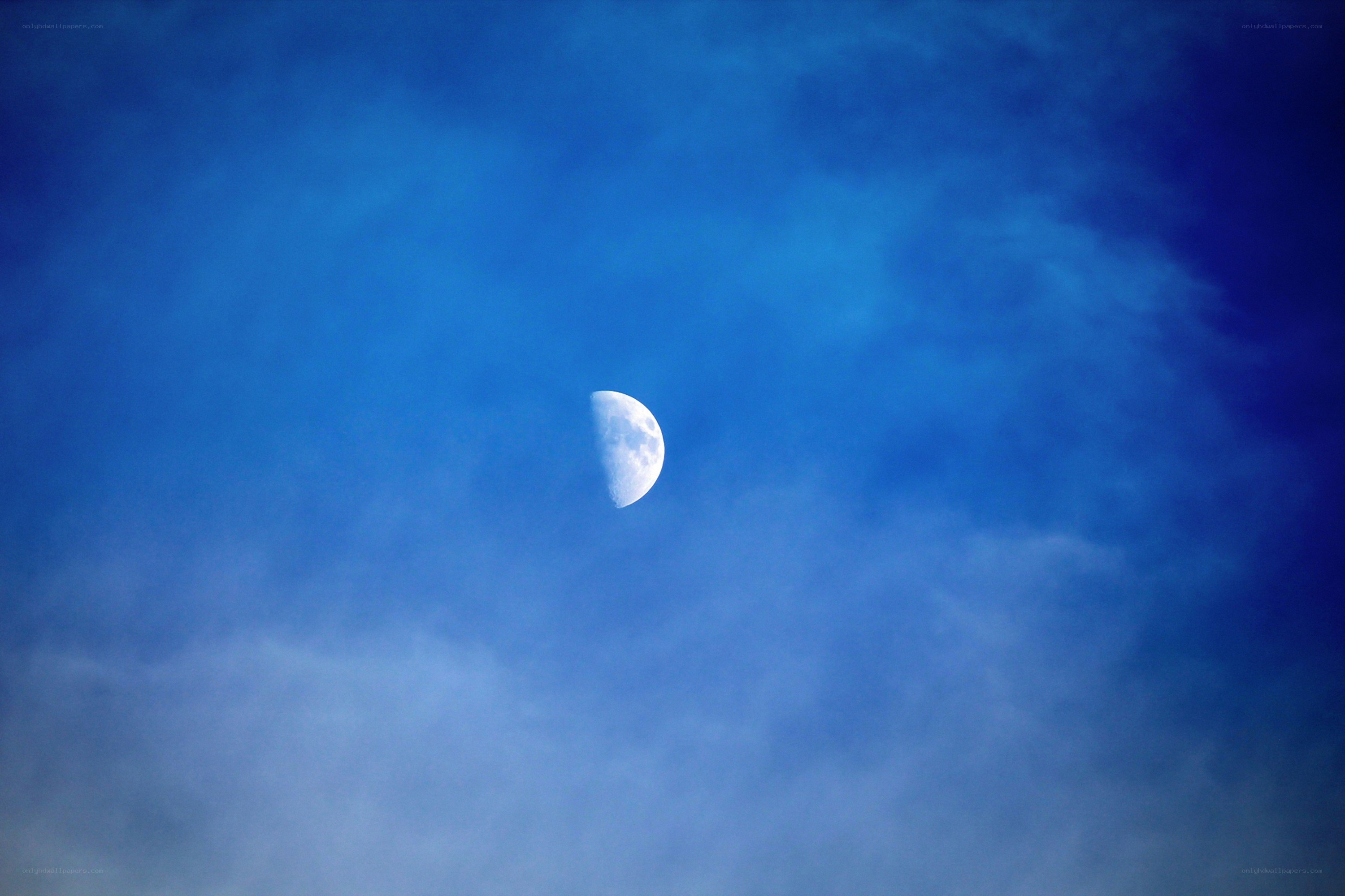 Moon in a blue sky