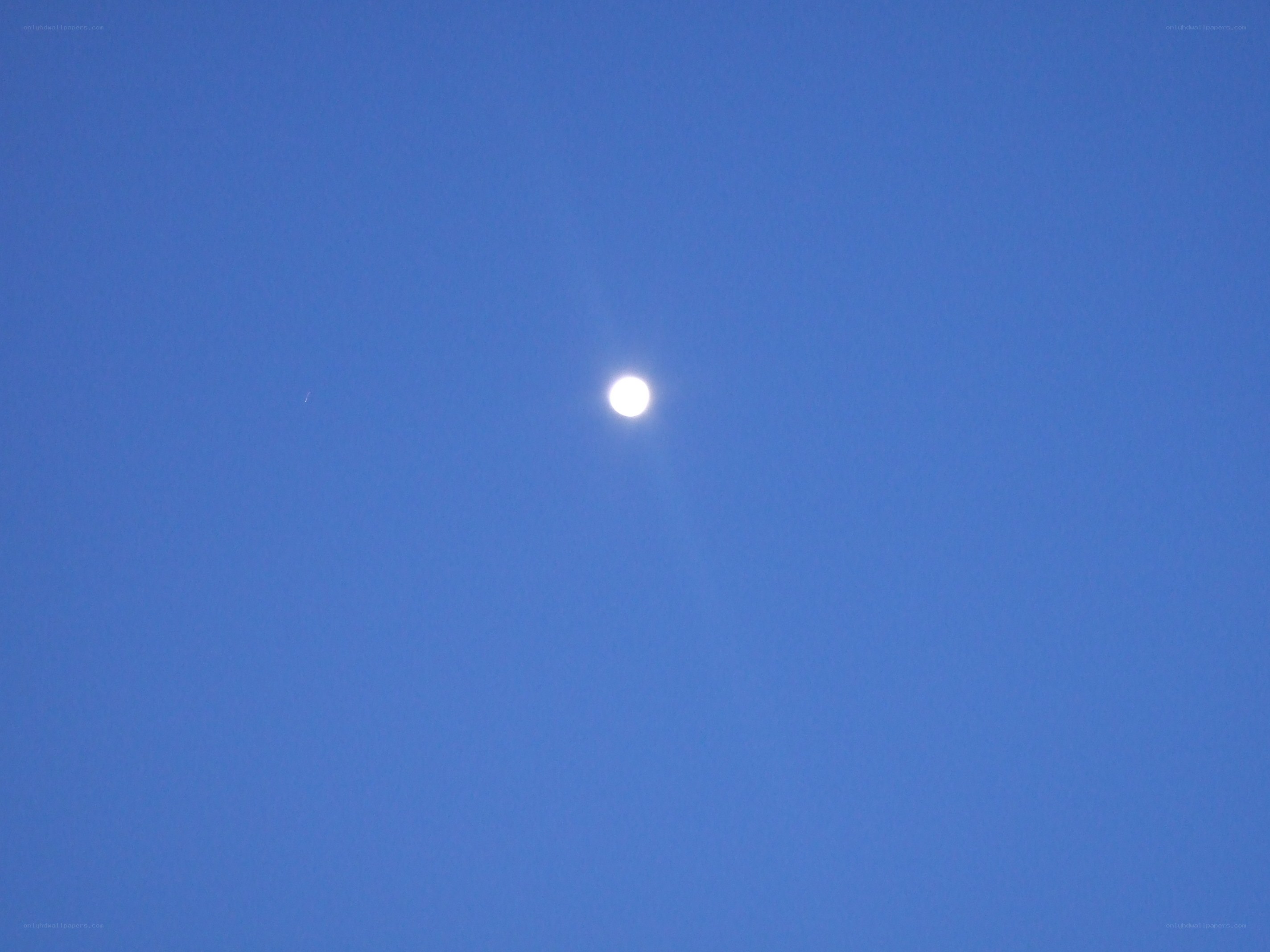 Moon in blue sky