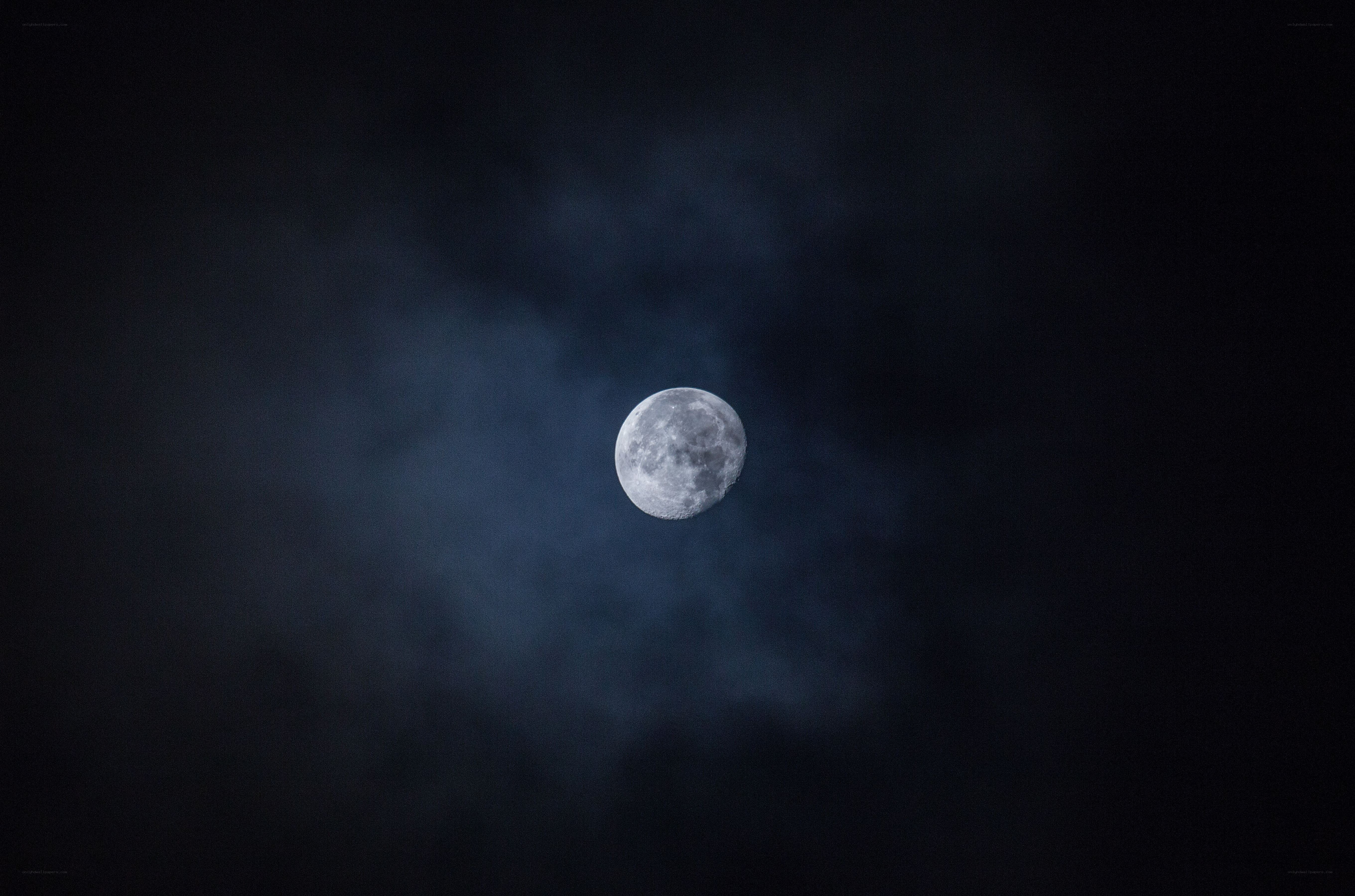 Moon in cloudy night sky