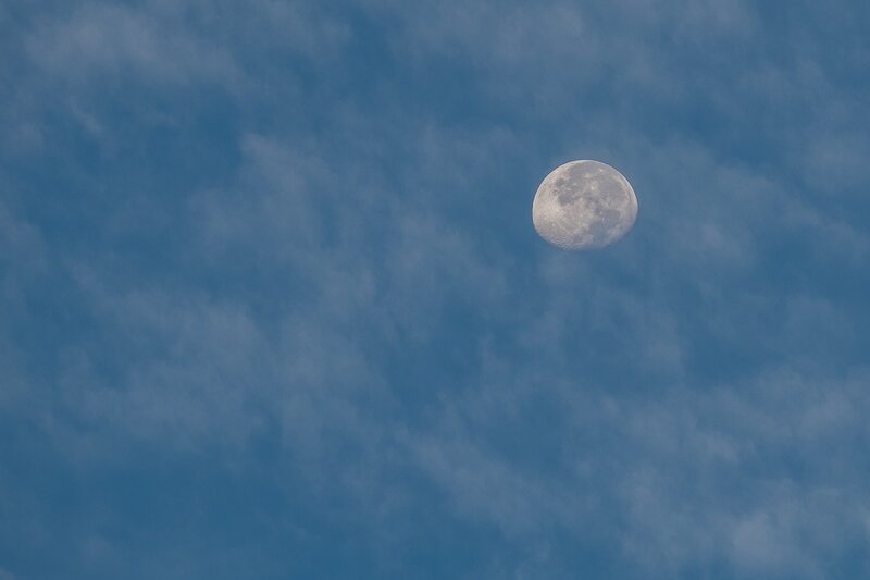 Moon in Cloudy Sky — Blue, Serene, Photograph