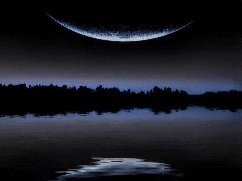 Moon over a calm lake