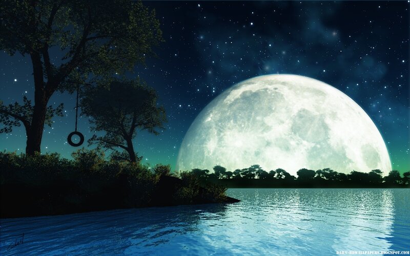 Moon over a lake at night