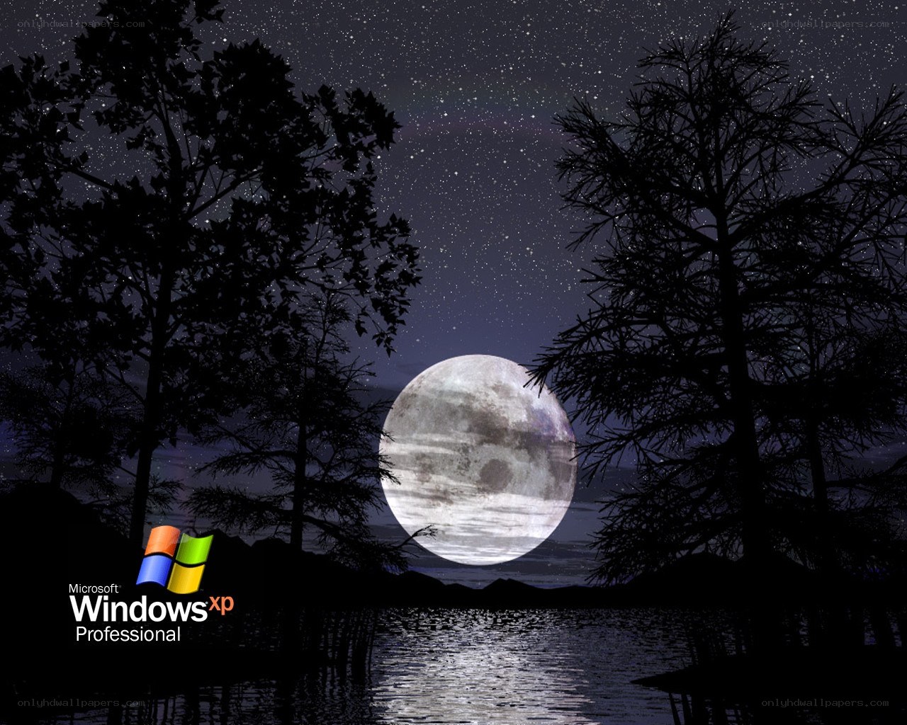 Moon over a lake at night