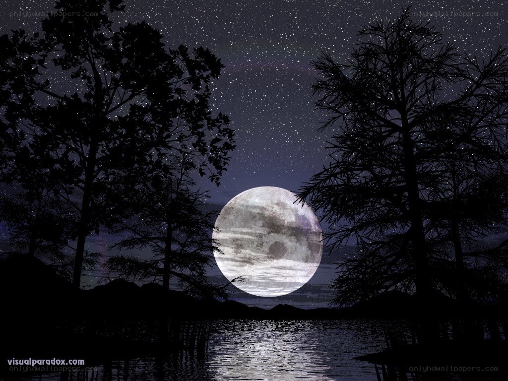 Moon over a lake at night