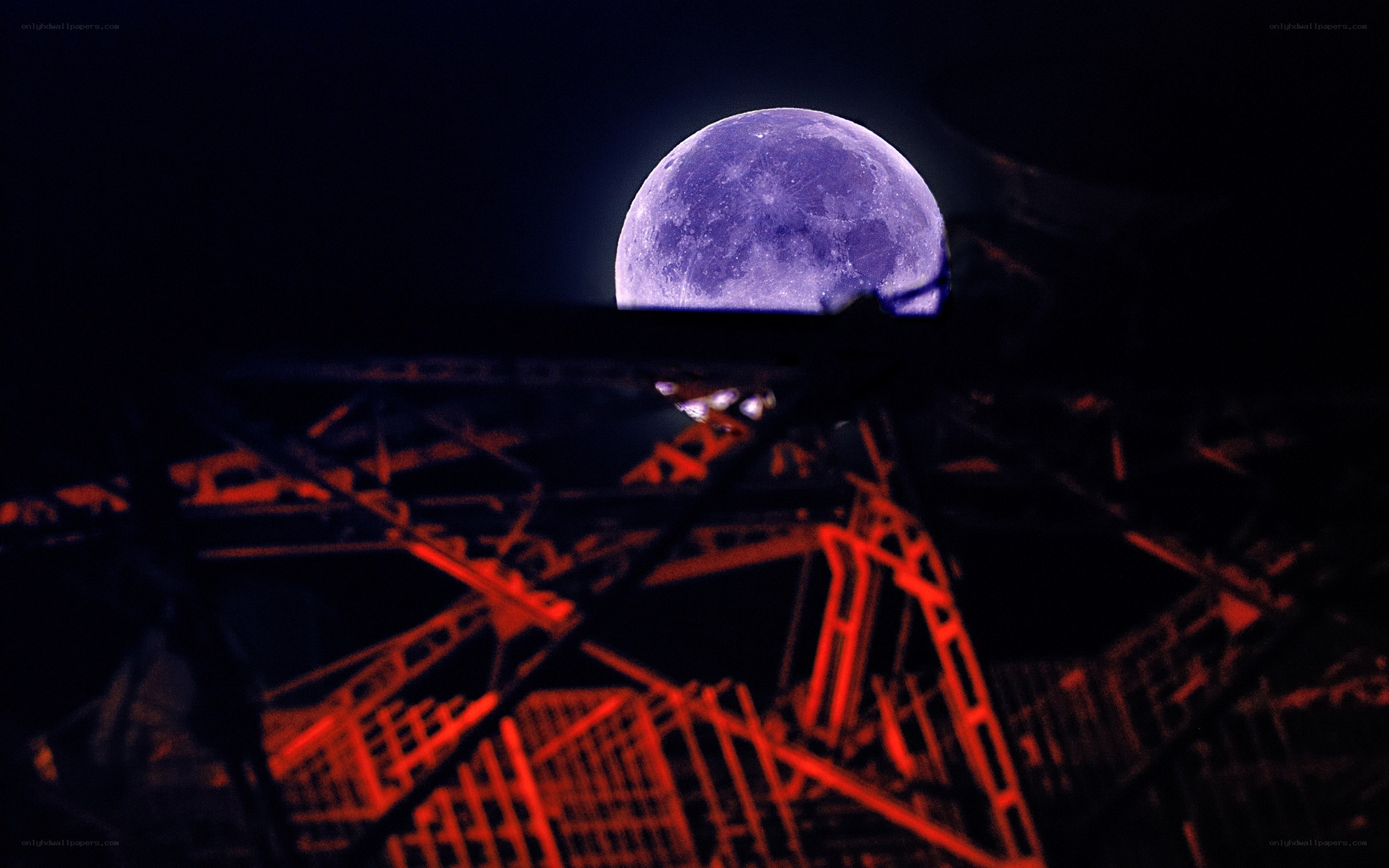 Moon over a red structure
