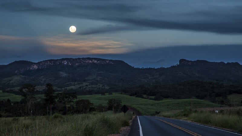 Moon over a rural road
