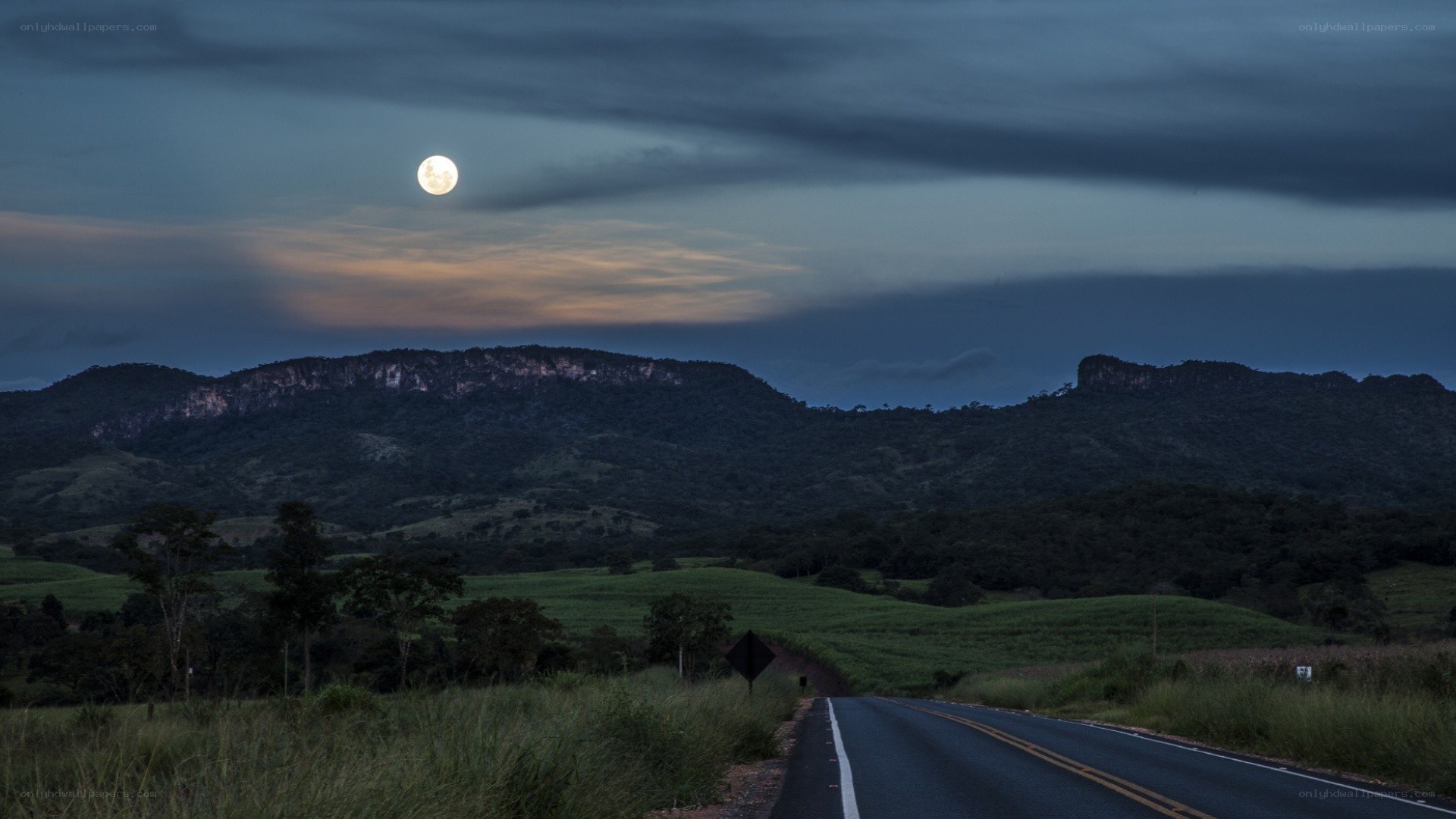 Moon over a rural road