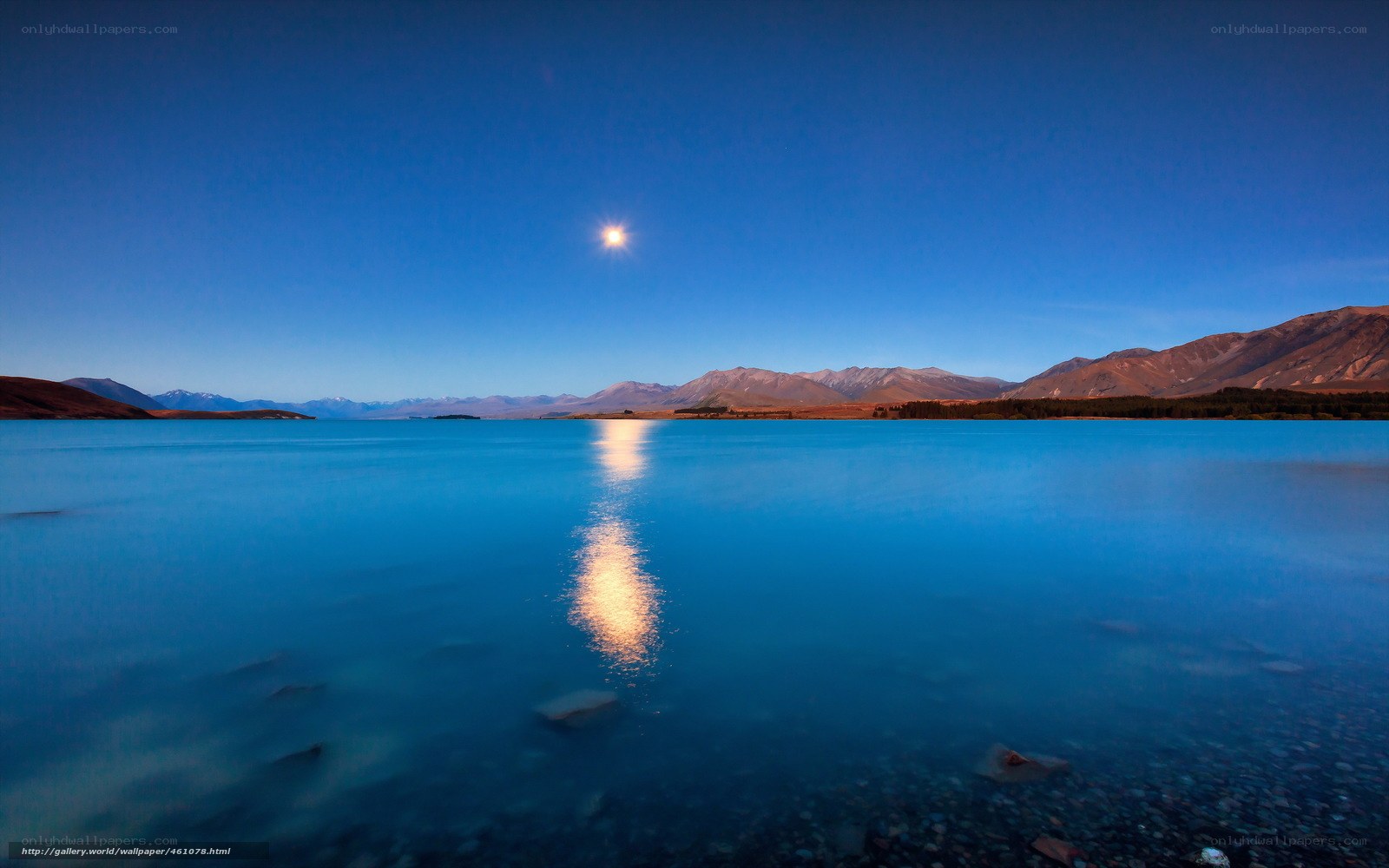 Moon over a serene lake