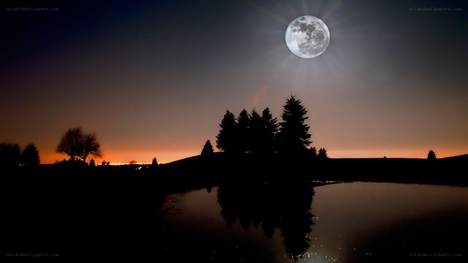 Moon over a still lake