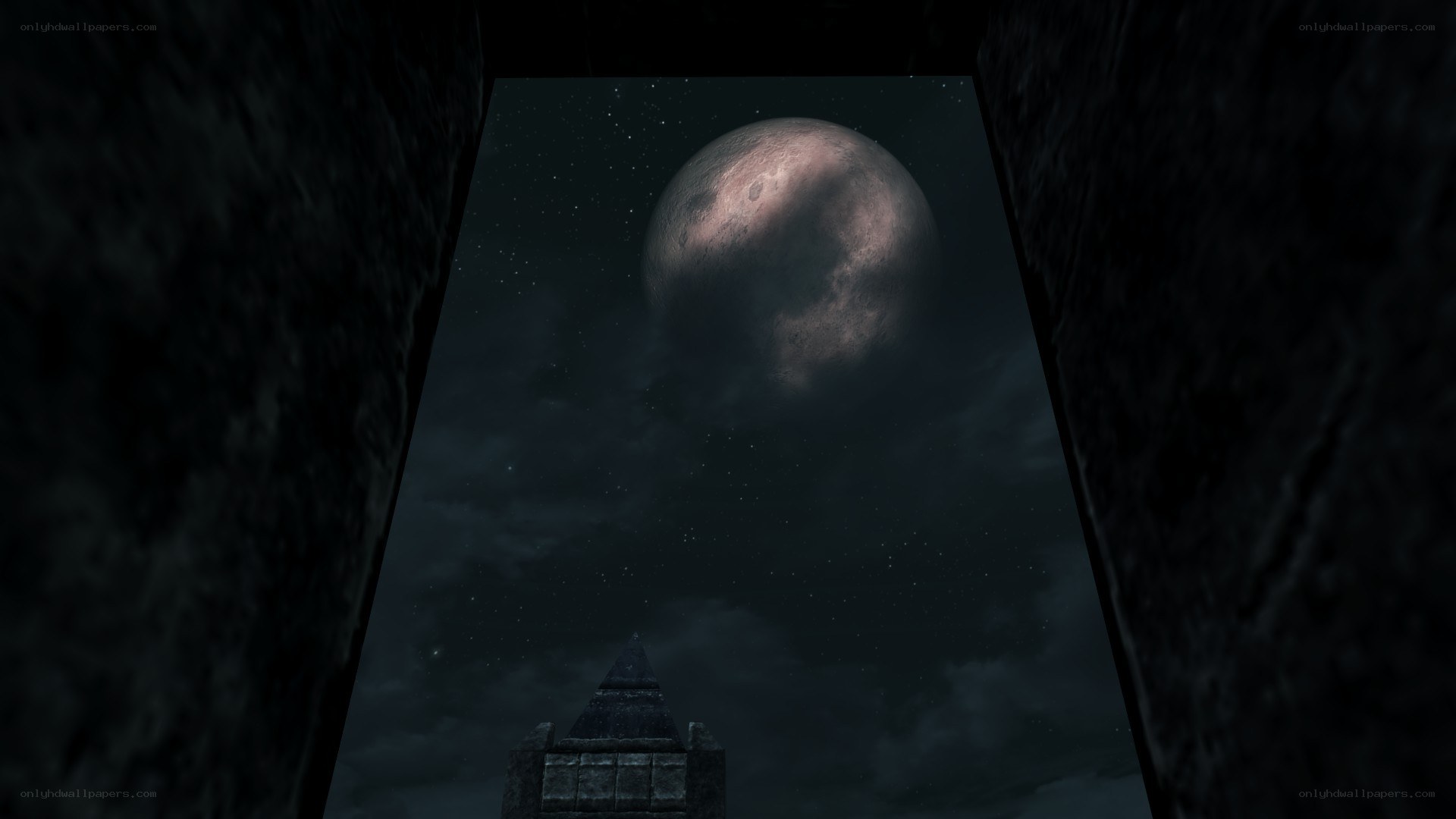 moon over ancient ruins