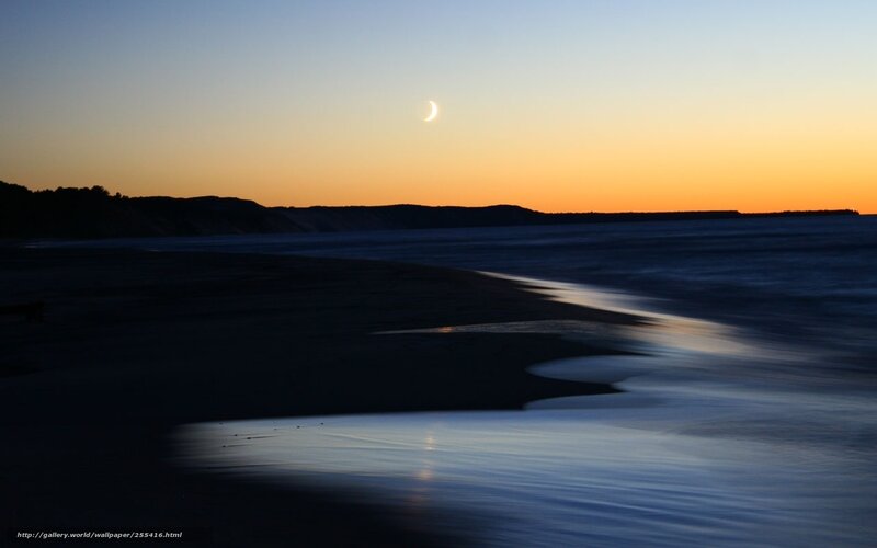 Moon over beach at dusk