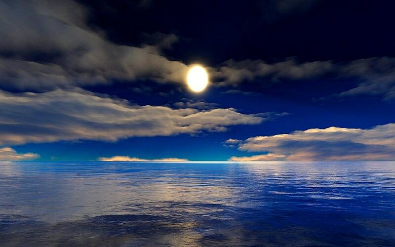 Moon over calm ocean