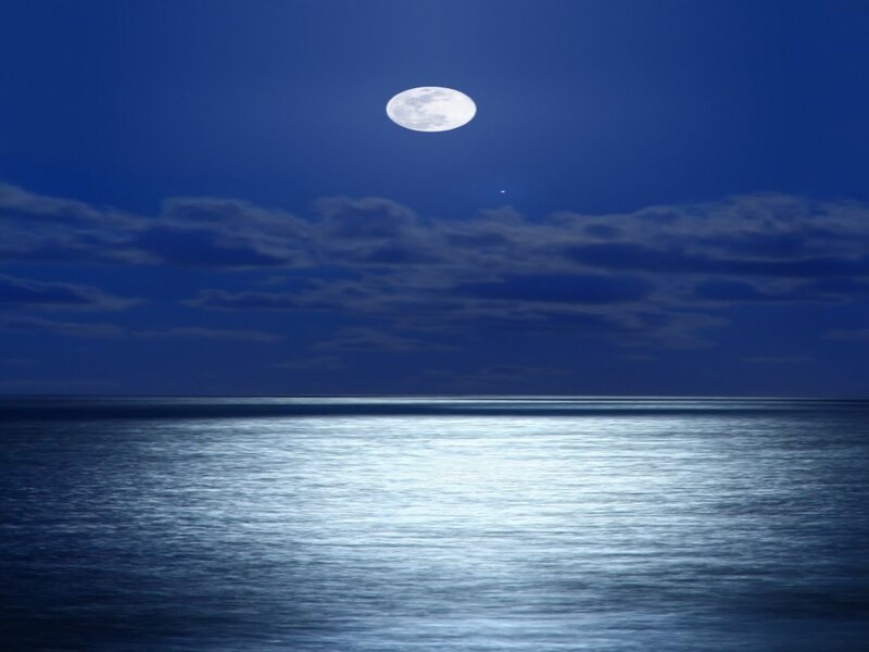 Moon over calm ocean