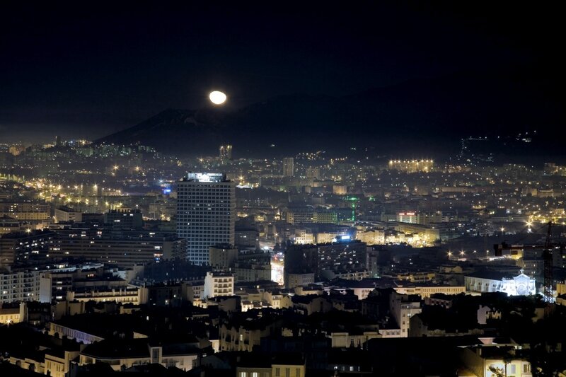 Moon over city at night