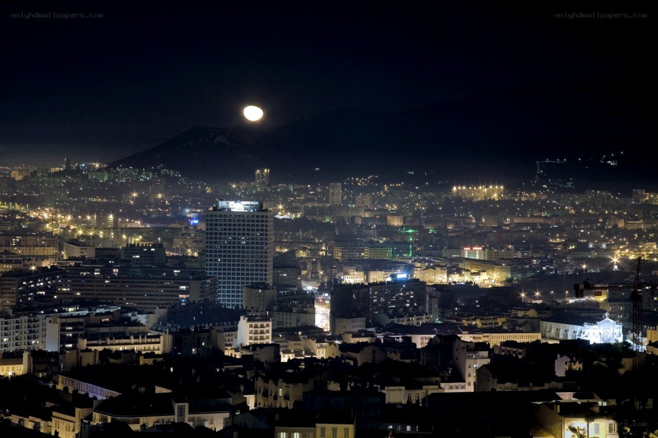 Moon over city at night