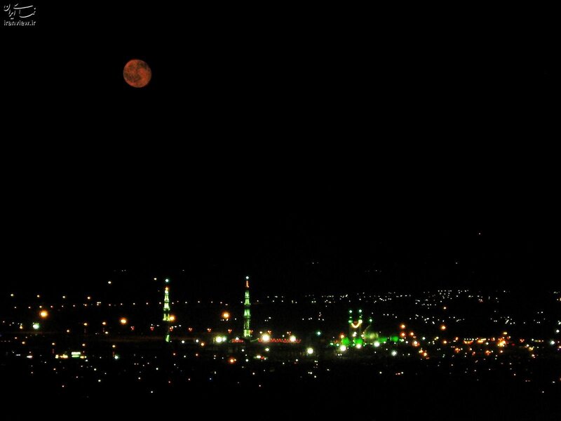Moon over city at night
