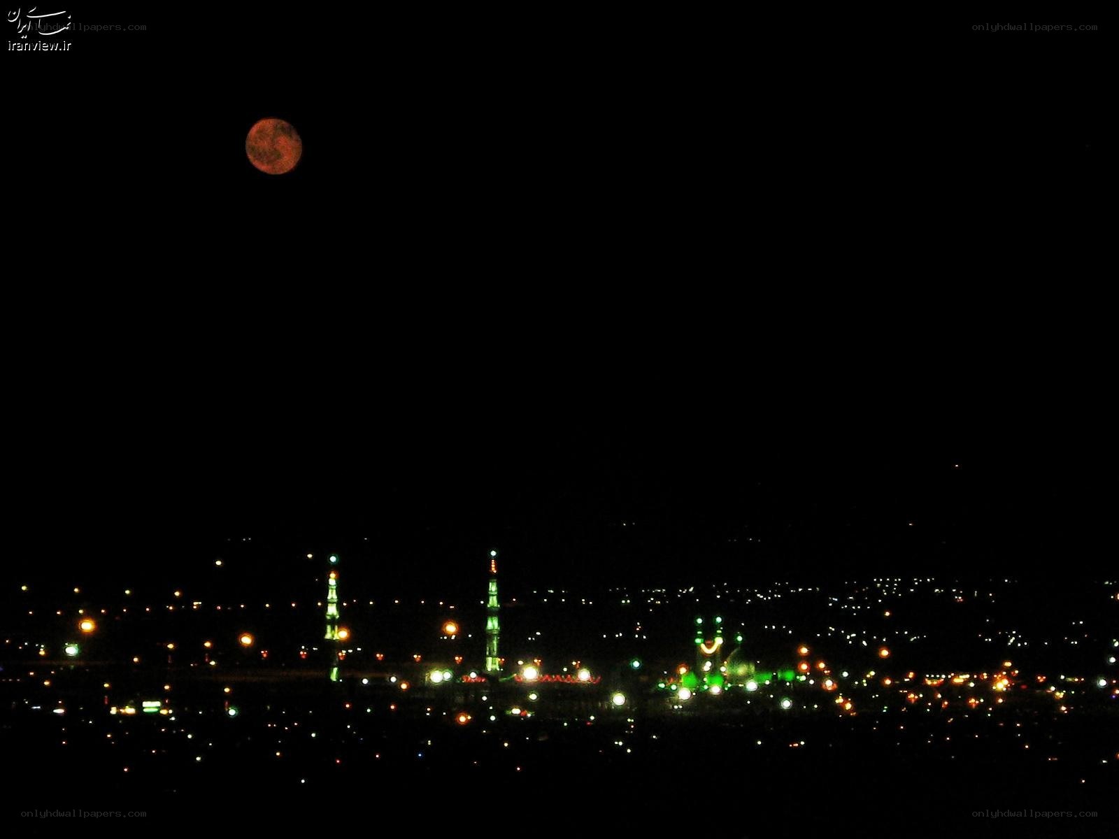 Moon over city at night