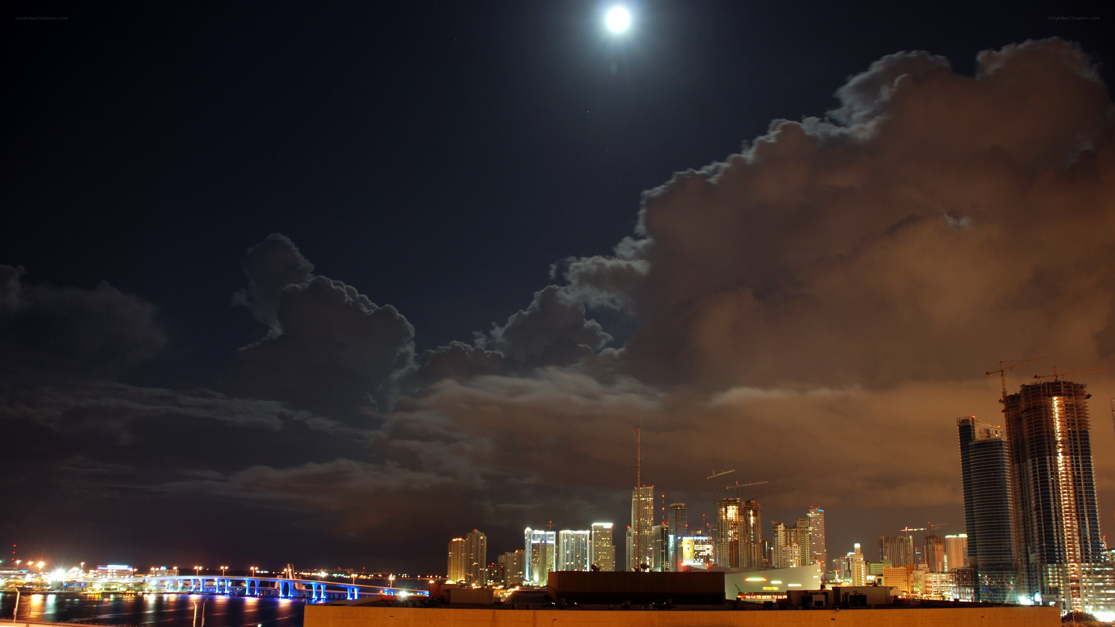 Moon over city skyline