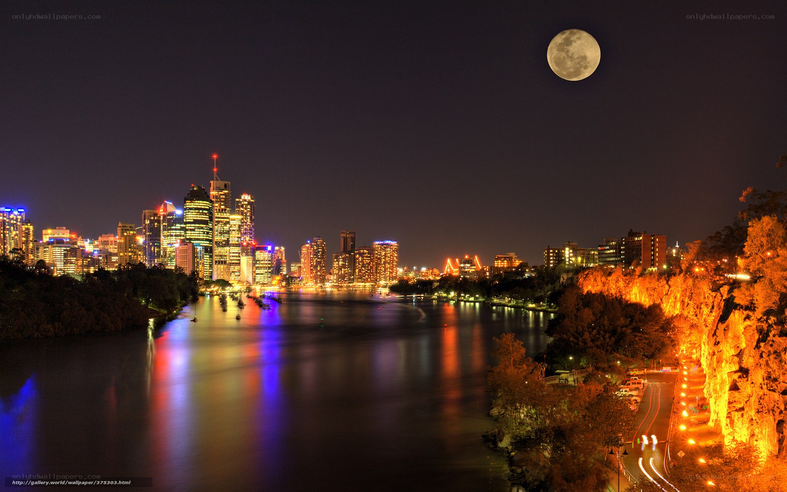 Moon over city skyline