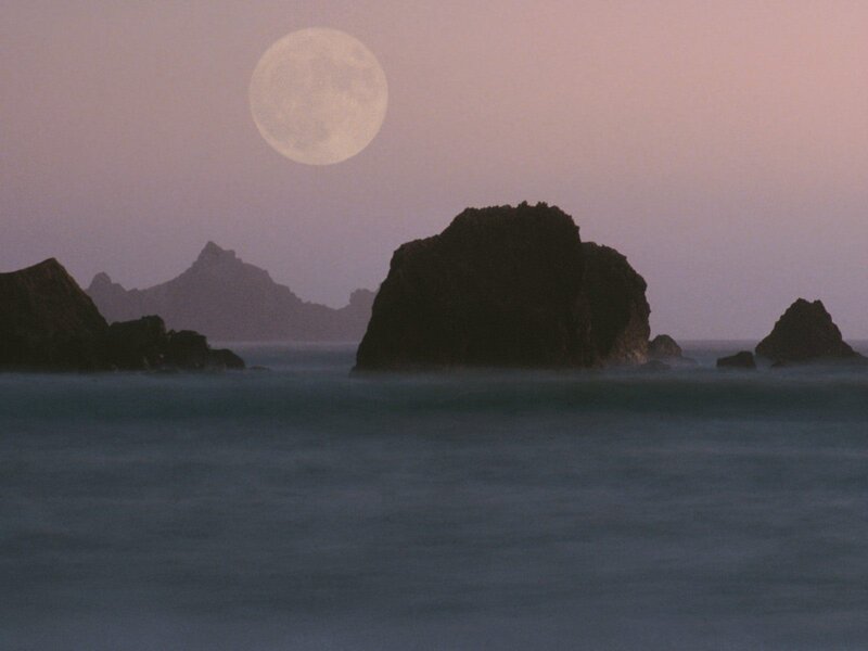 Moon over coastal rocks