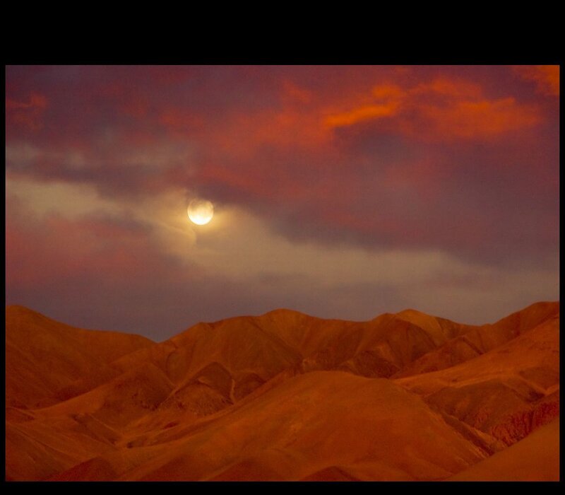 Moon over desert mountains