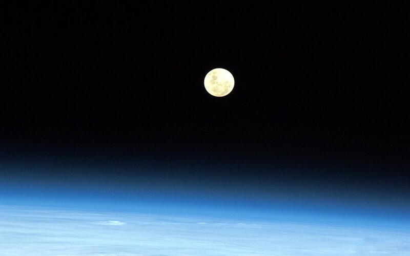 Moon over Earth from space