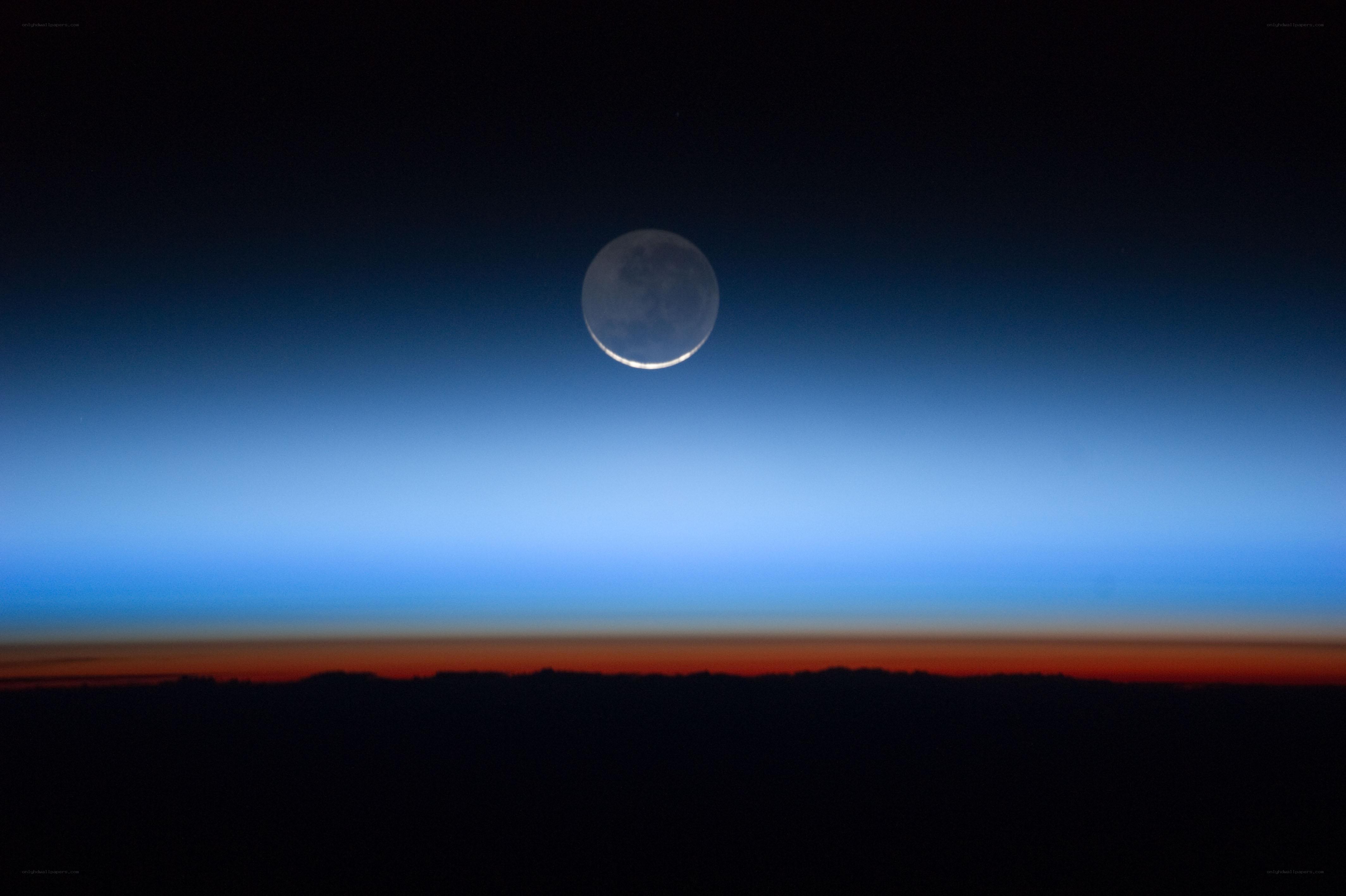 Moon over Earth's horizon