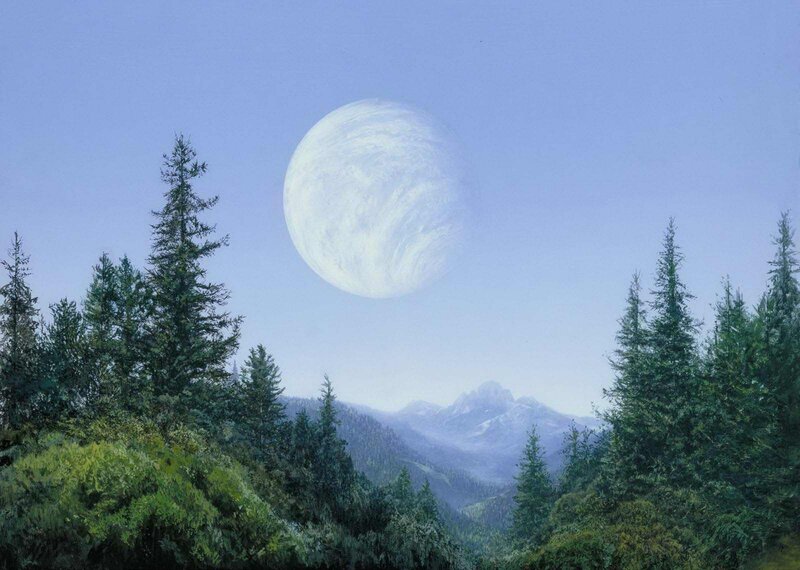 Moon over forested mountains