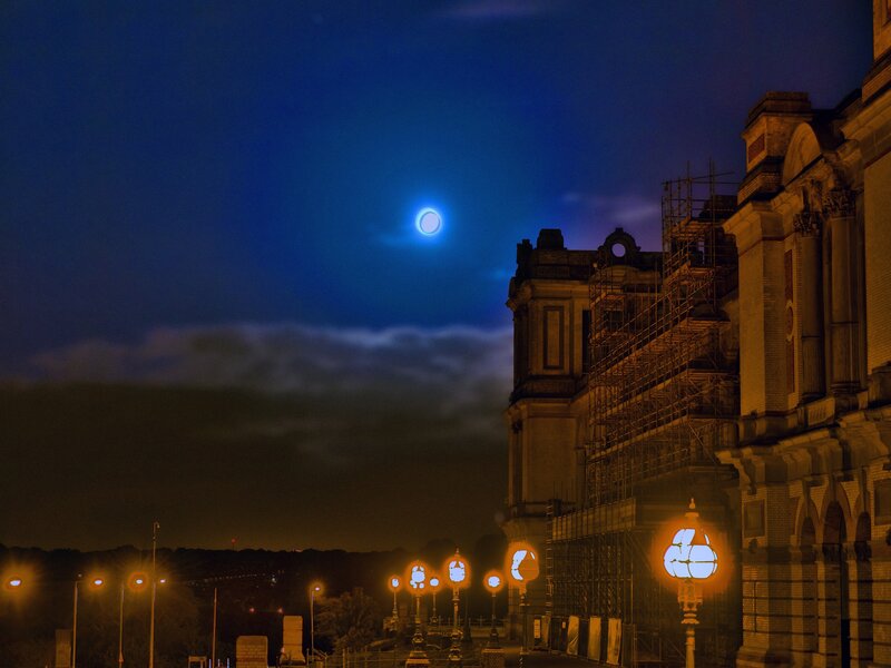Moon over historic building