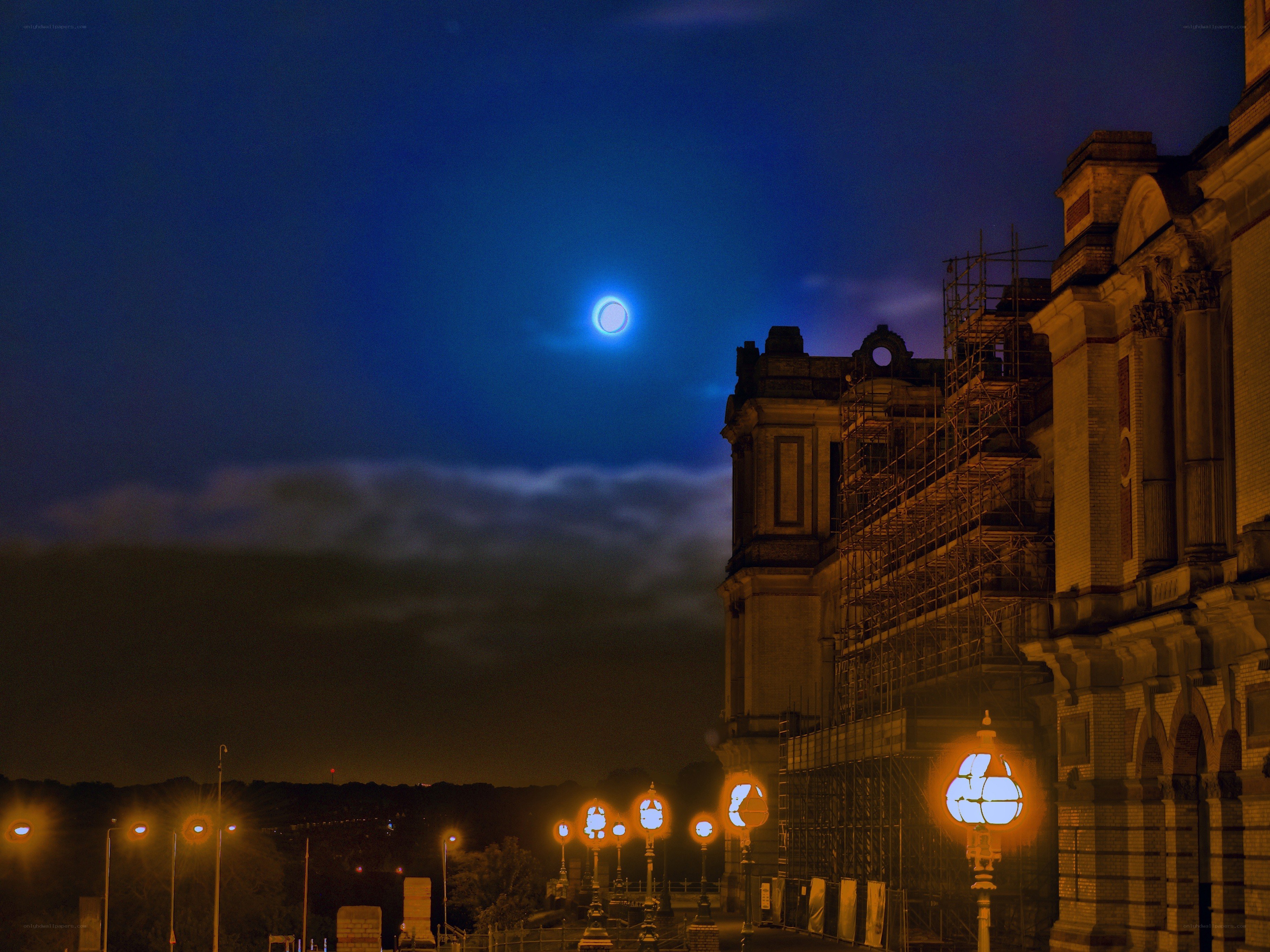 Moon over historic building