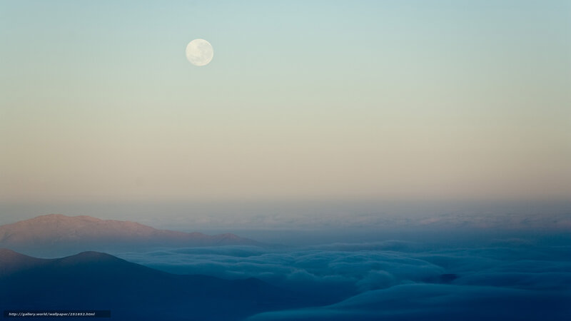 Moon over mountain clouds