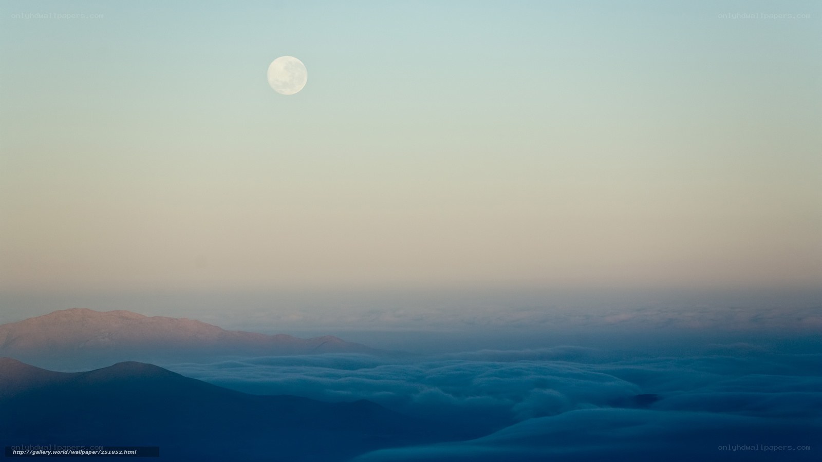 Moon over mountain clouds