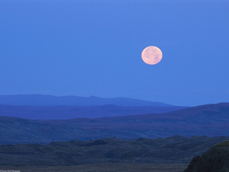 Moon over mountain landscape