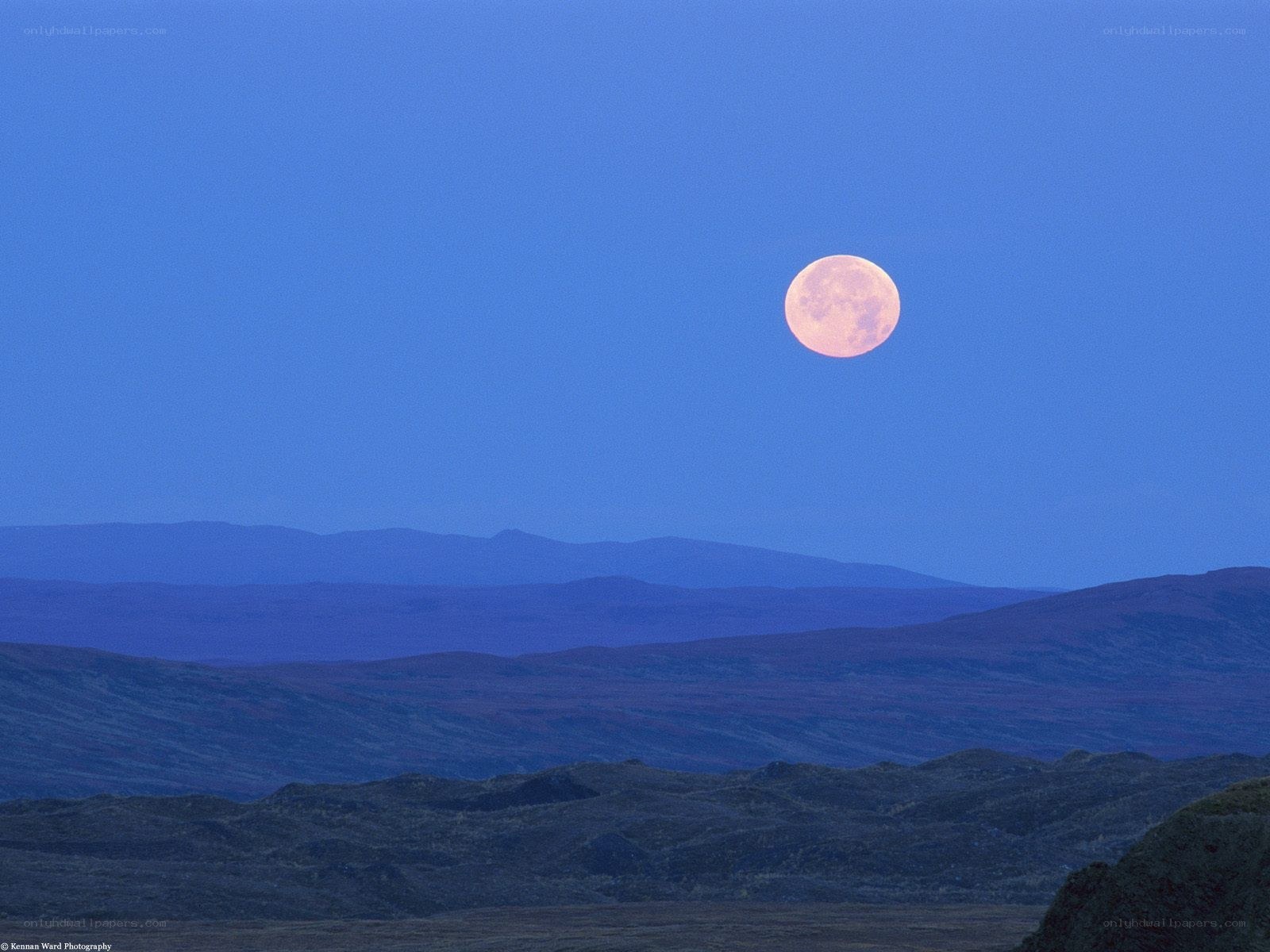 Moon over mountain landscape