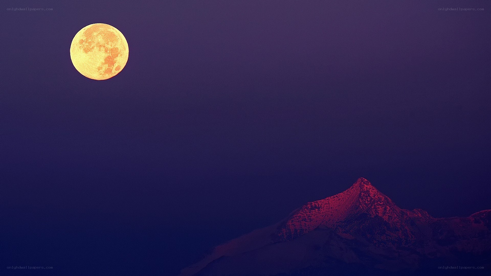 Moon over mountain peak