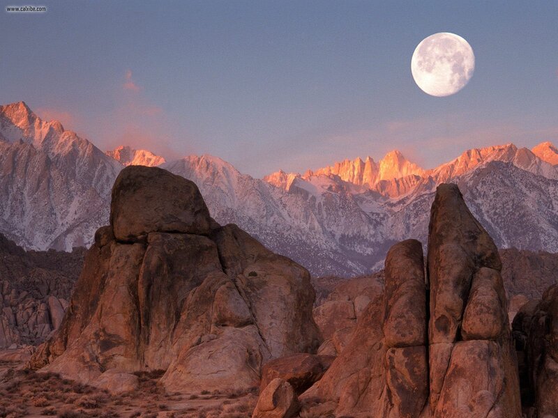 Moon over mountain peaks