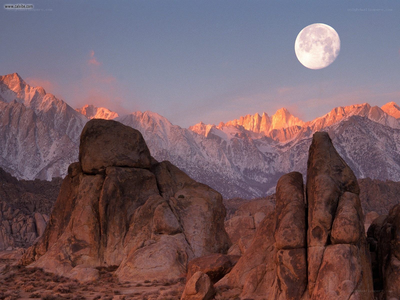 Moon over mountain peaks