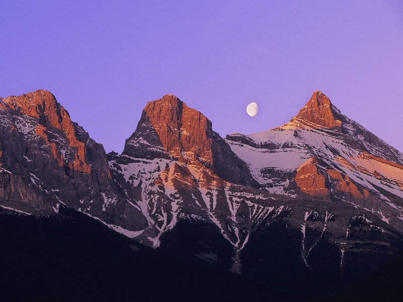 Moon over mountain peaks