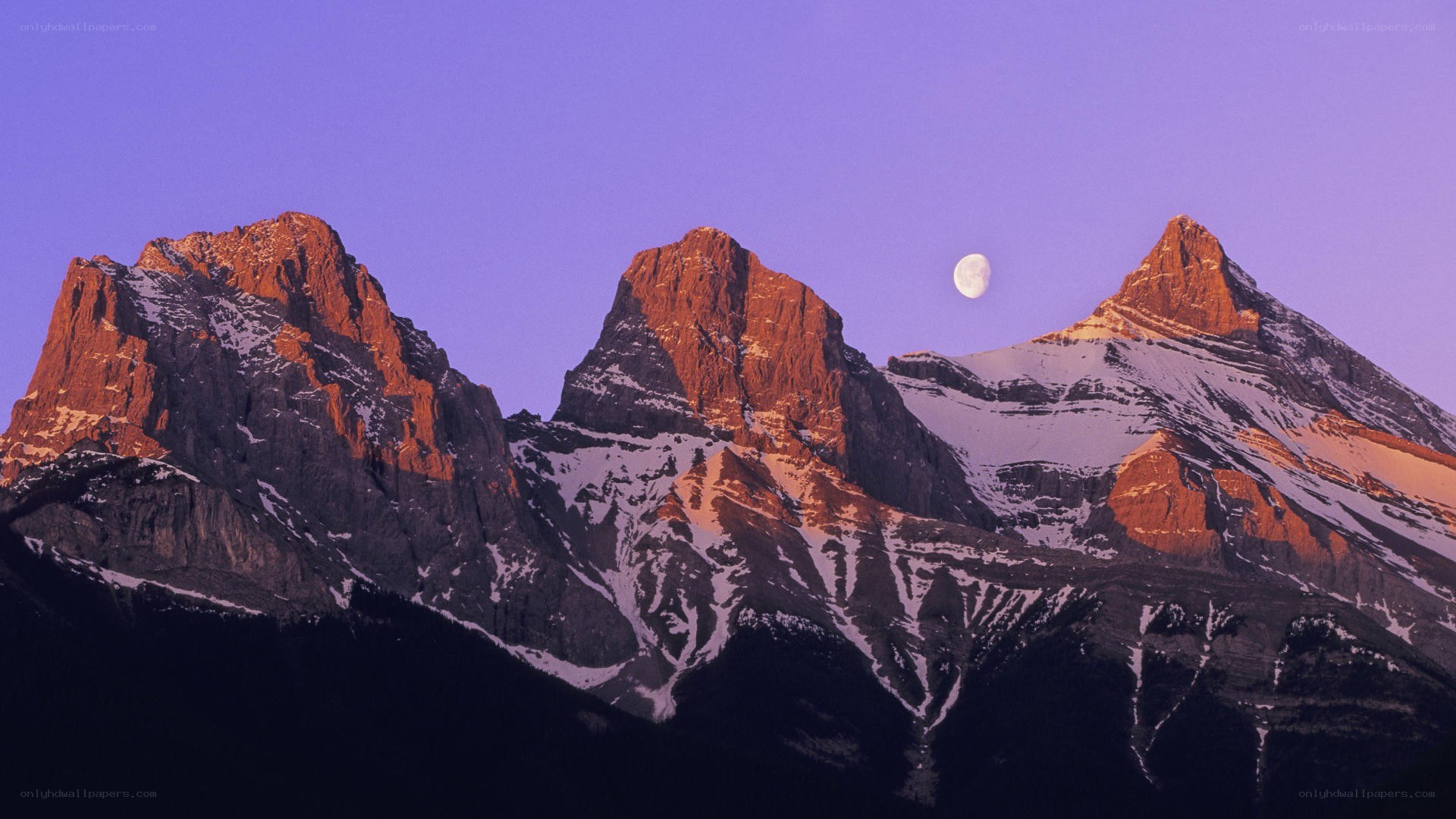Moon over mountain peaks