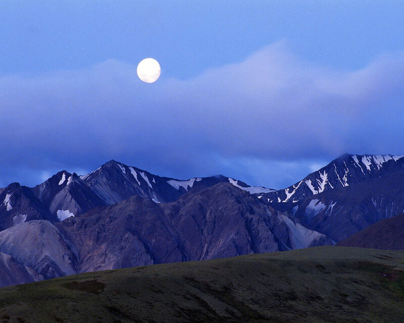 Moon over mountain range