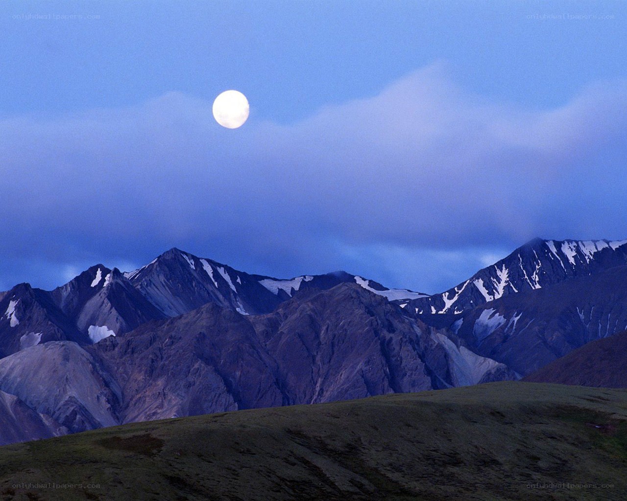 Moon over mountain range