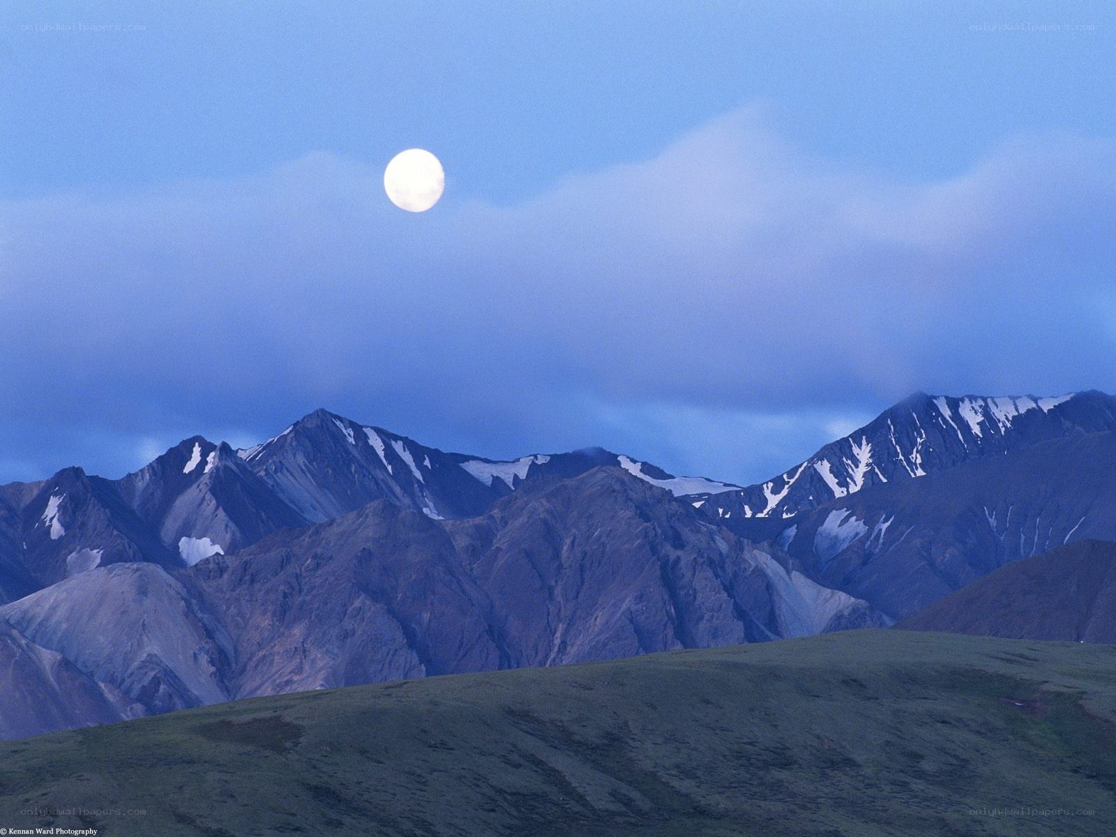 Moon over mountain range