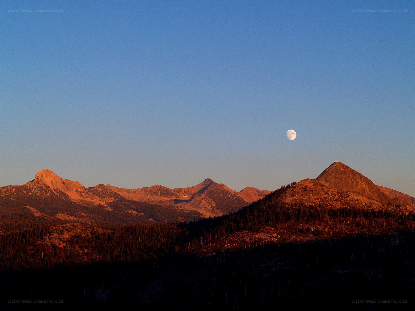 Moon over mountain range