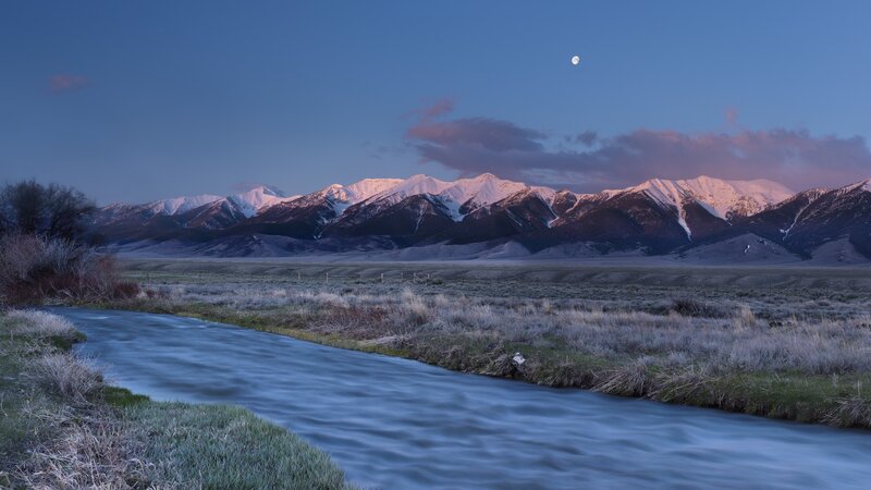 Moon over mountain river