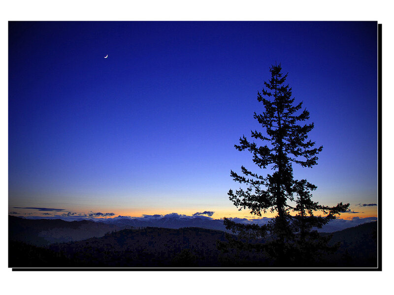 Moon over mountain silhouette