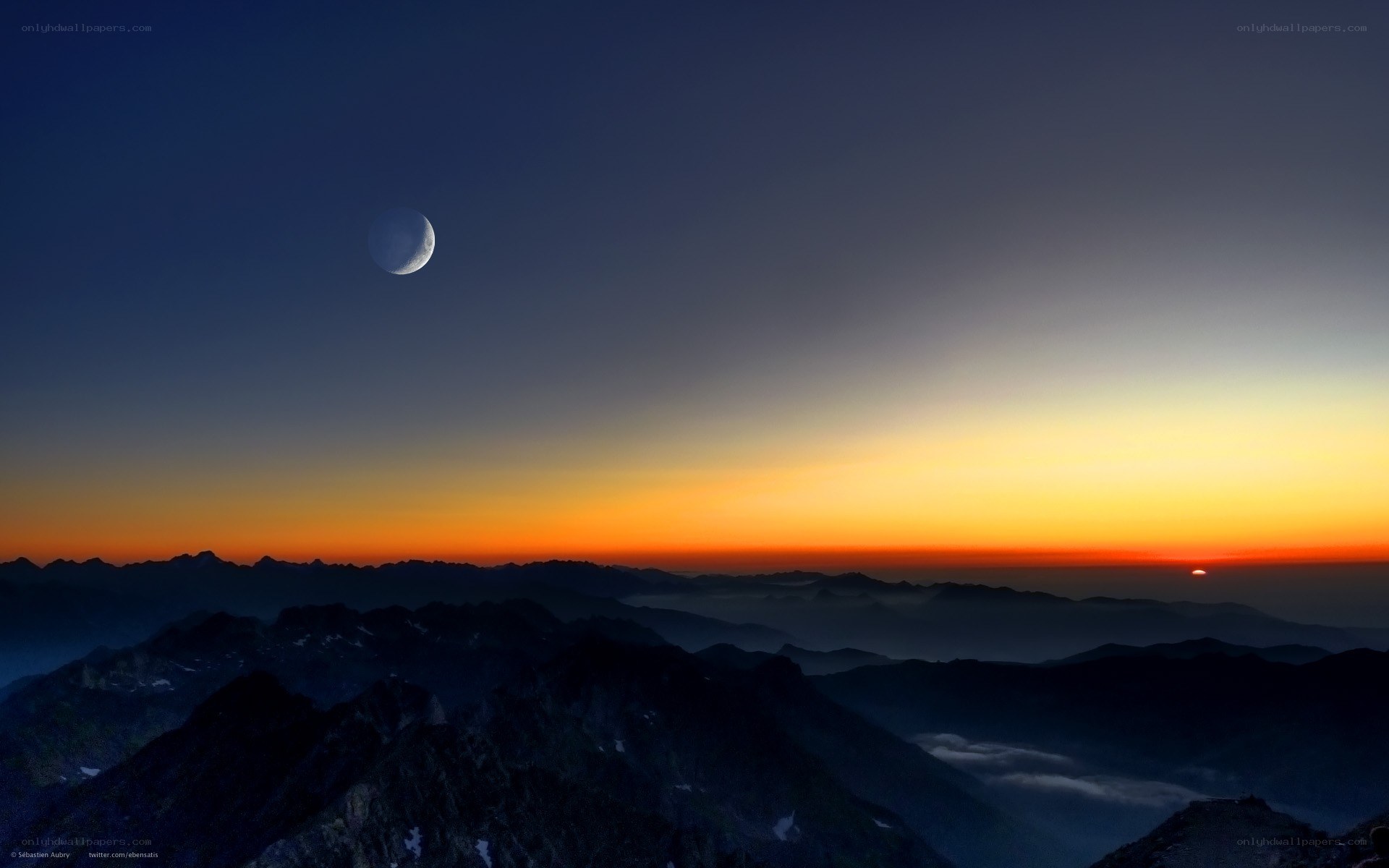 Moon over mountain sunset
