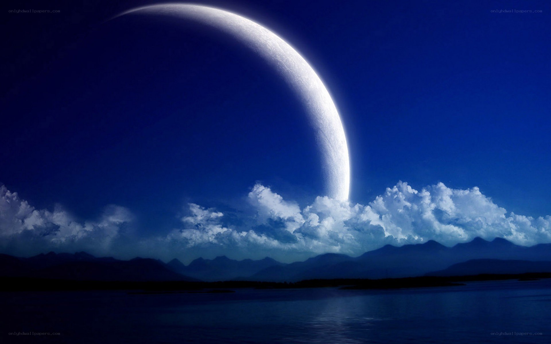 Moon over mountains and lake