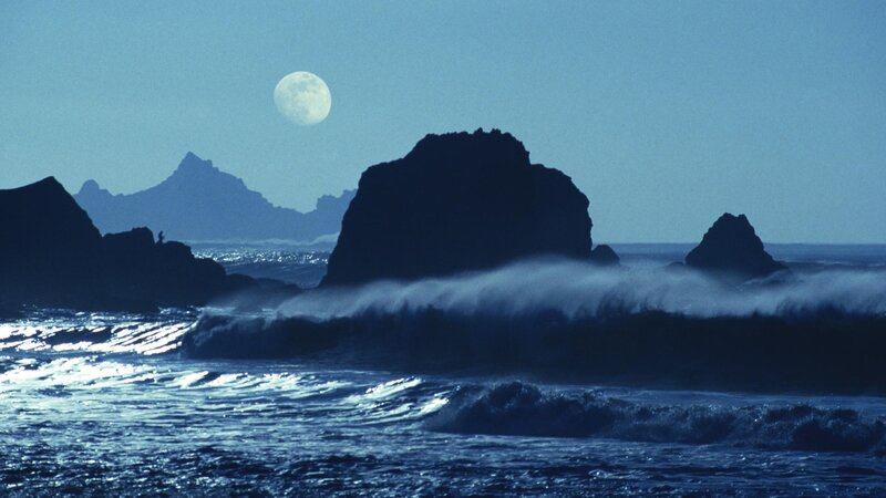Moon over ocean waves